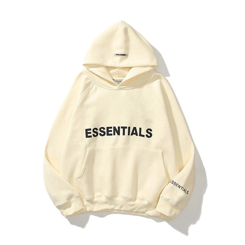 Essentials Oversized Fleece Hooded Sweatshirt in beige color, featuring the "Essentials" branding on the front.